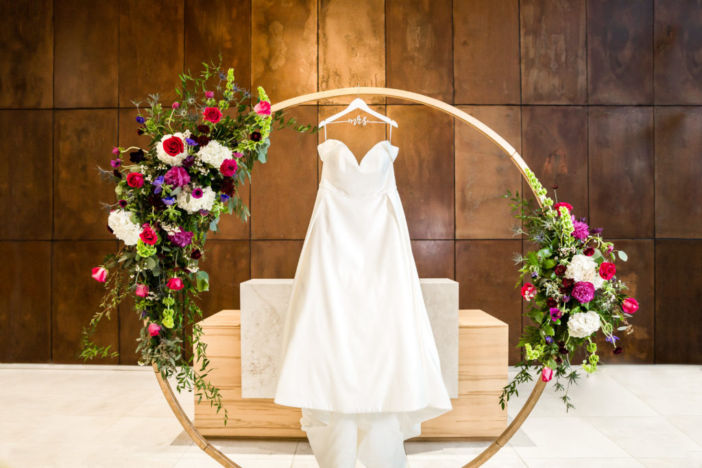 Hanging dress shot with moon door and florals