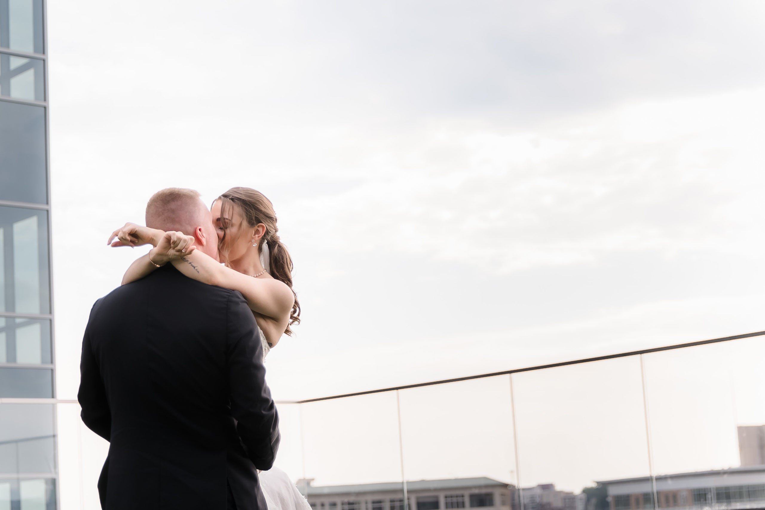 Kissing on the rooftop of the AC Hotel Greenville